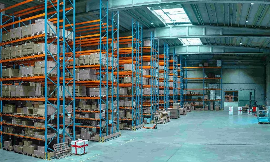Multi-level orange and blue pallet racking